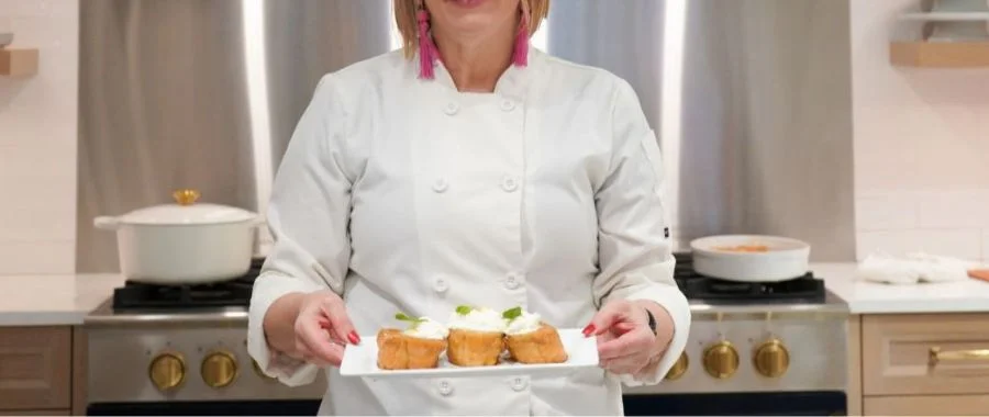 Chef Susan showcasing three slices of her orange caramel French toast