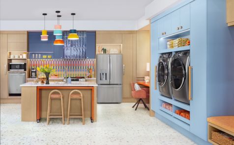 Wide angle shot of a blue and cream colored kitcche fitted with all ge appliances