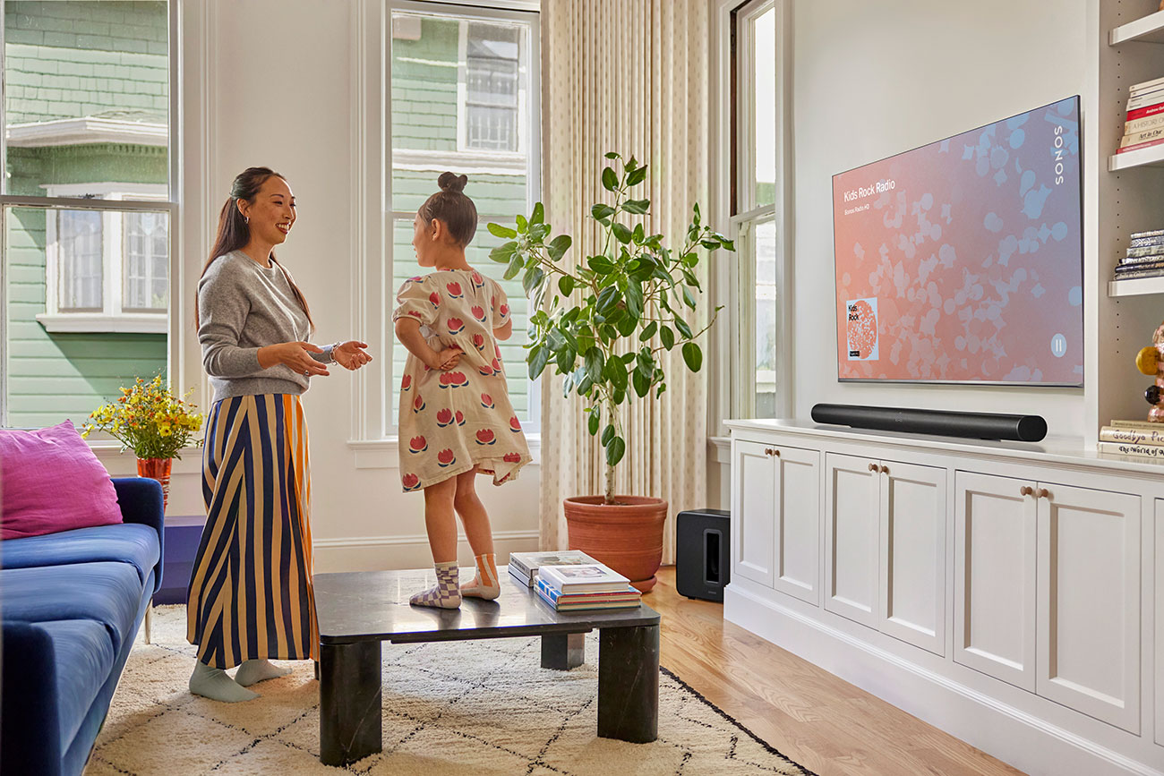 Family Listening to SONOS Subwoofer in Living Room