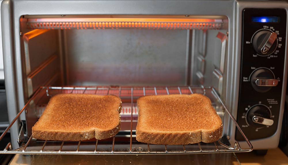 Open toaster oven with toast inside