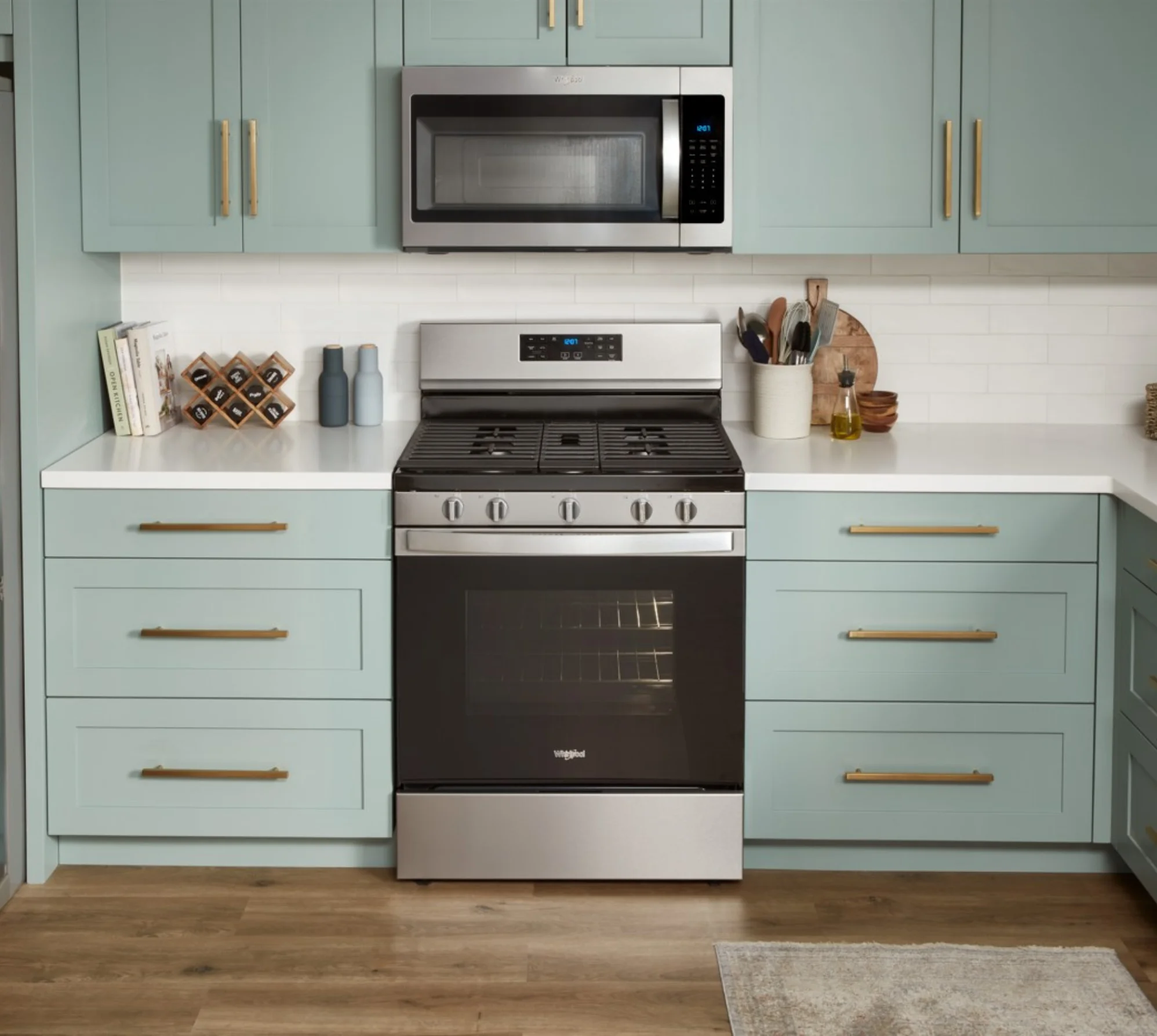 Wide shot of a luxury outoor kitchen showcasing a built in lynx grill with full outdoor kitchen accessories