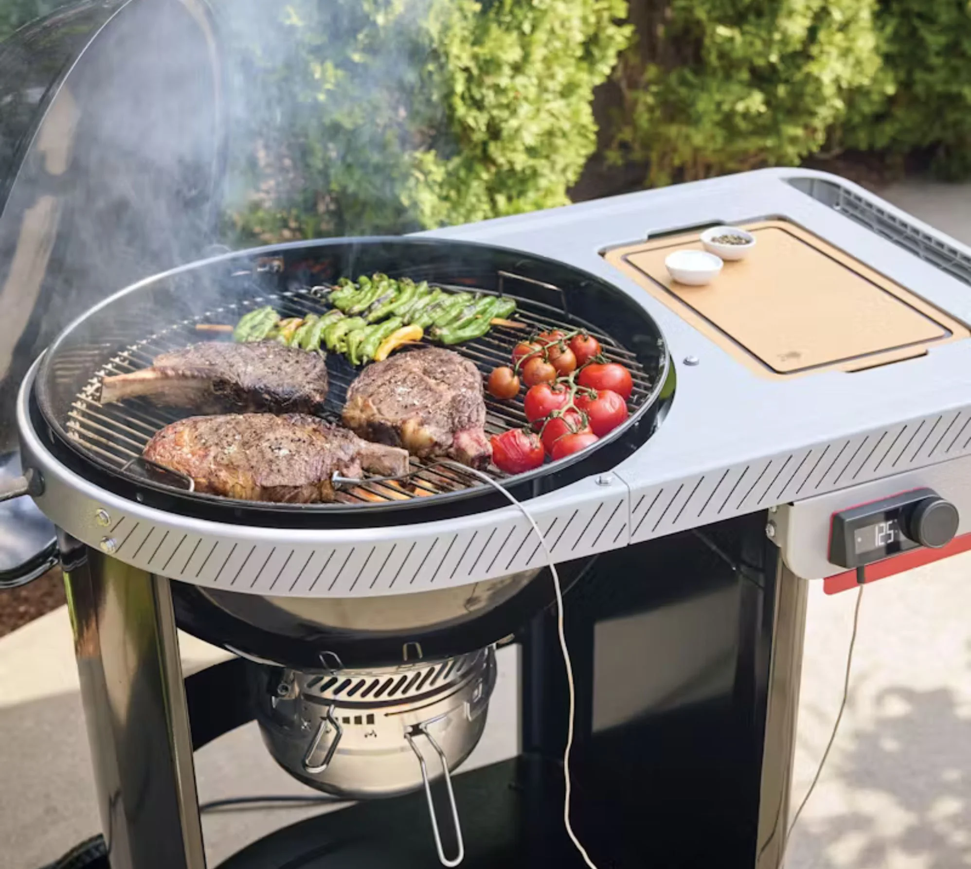 A close up of a Weber Performer grilling surface