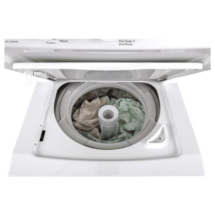 Open washer lid with sheets inside.