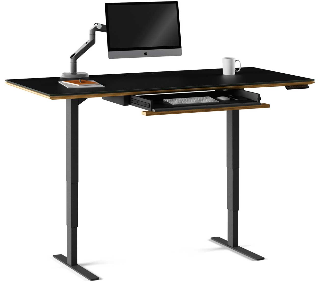 View of bdi natural walnut lift desk with monitor and desk set up
