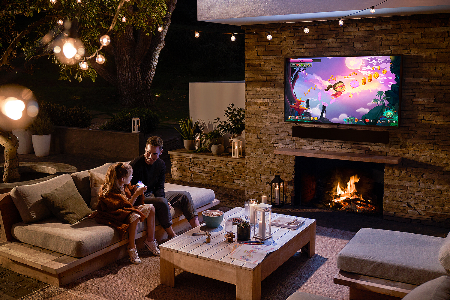 Lifestyle image of Samsung The Terrace Black QLED 4K UHD Outdoor Smart HDTV