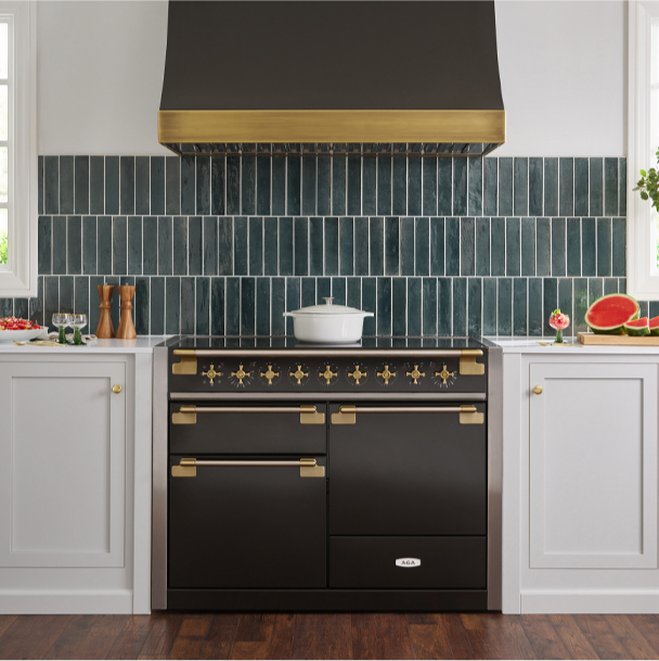 Aga Black Elise Range in a sleek modern kitchen, featuring stylish gold hardware.