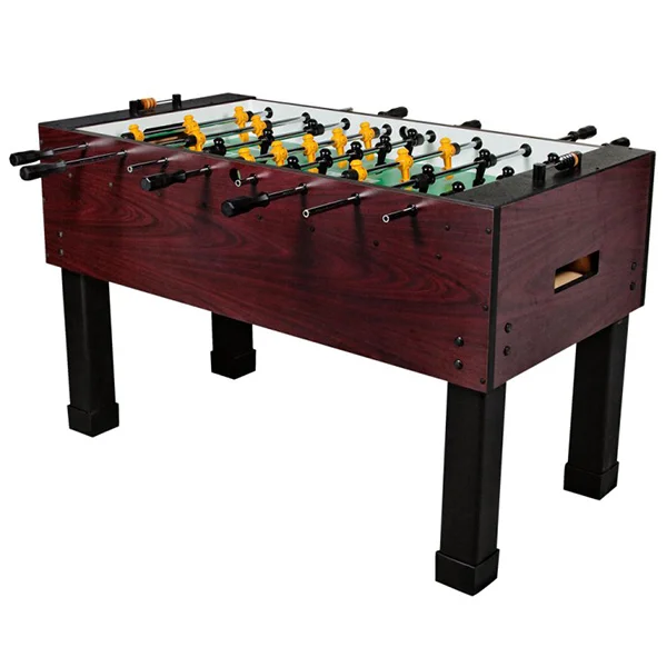 A dark wooden foosball table with black and yellow players