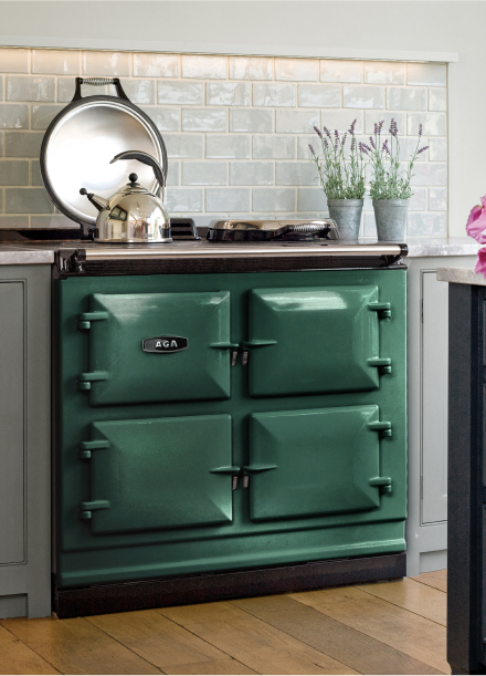 orest green Aga range prominently displayed in a modern kitchen, enhancing the space with its elegant design and color