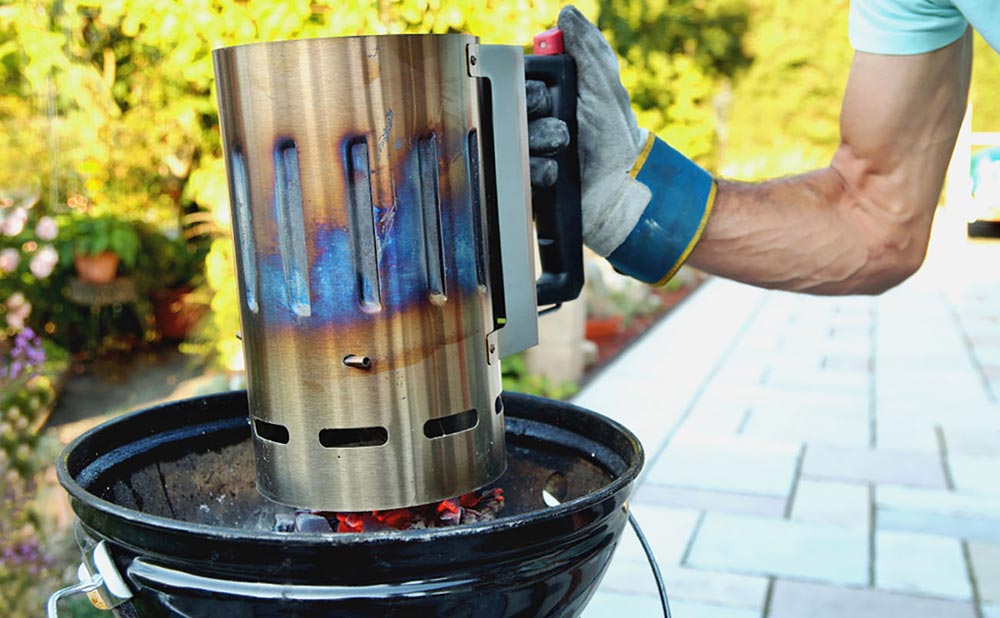 Person Using Grill Chimney Starter