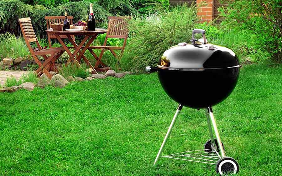 Weber Charcoal Grill on backyard lawn