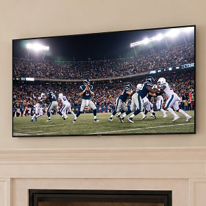 TV mounted above fireplace