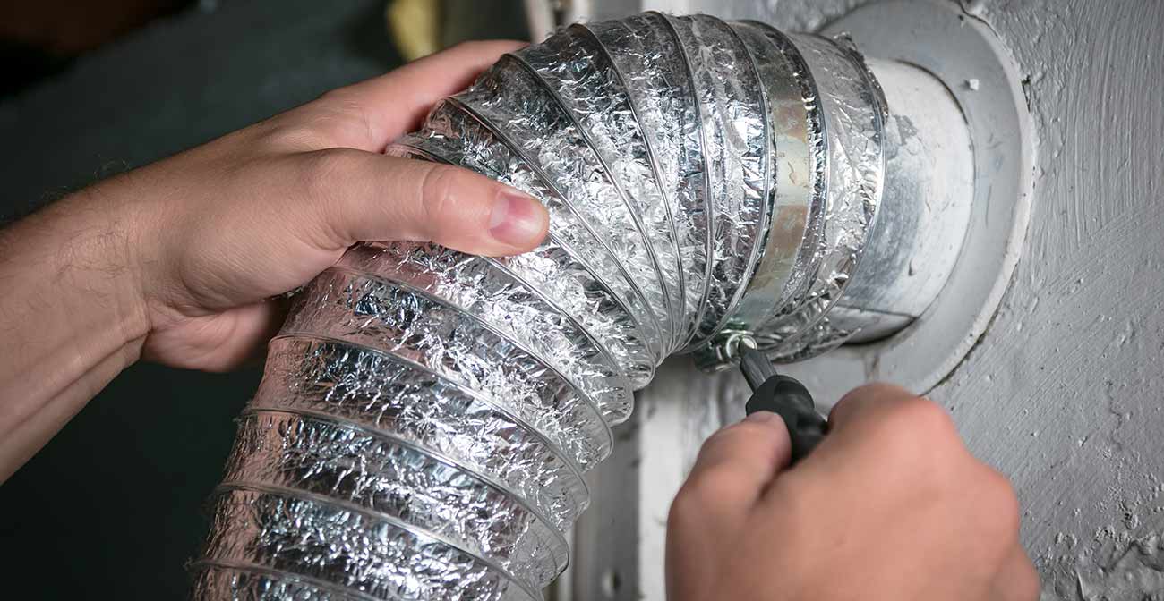 Person adjusting dryer vent