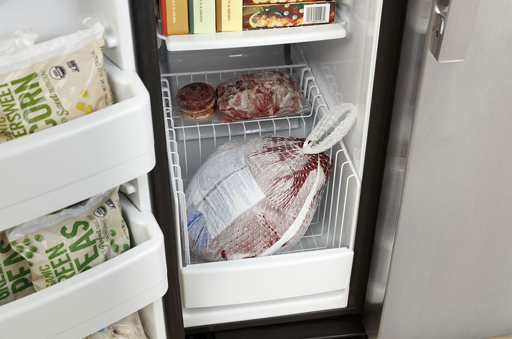 Angled view of freezer basket and full
