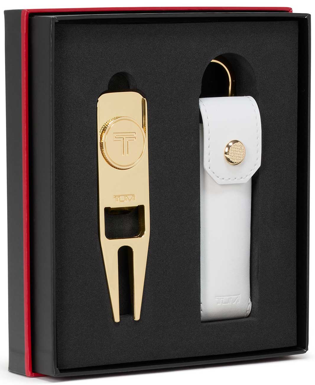 Inside of box view of TUMI gold Golf Divot Tool