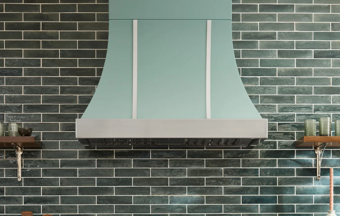 La Cornue range hood detail with brass trim