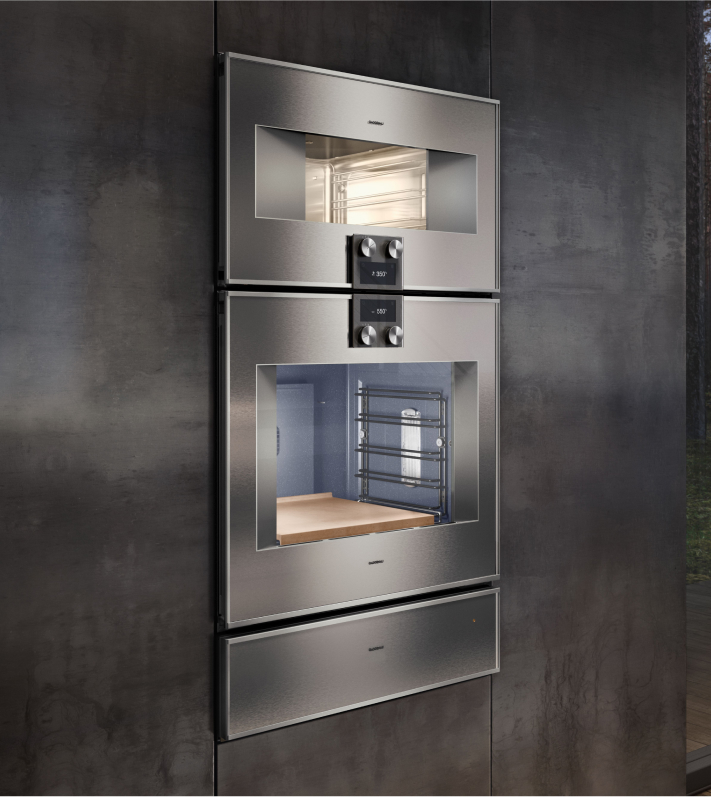 A Gaggenau wall oven featuring a sleek stainless steel exterior and a transparent glass door for easy viewing