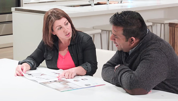 Two people discussing home estimates