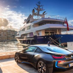 Car parked in front of yacht