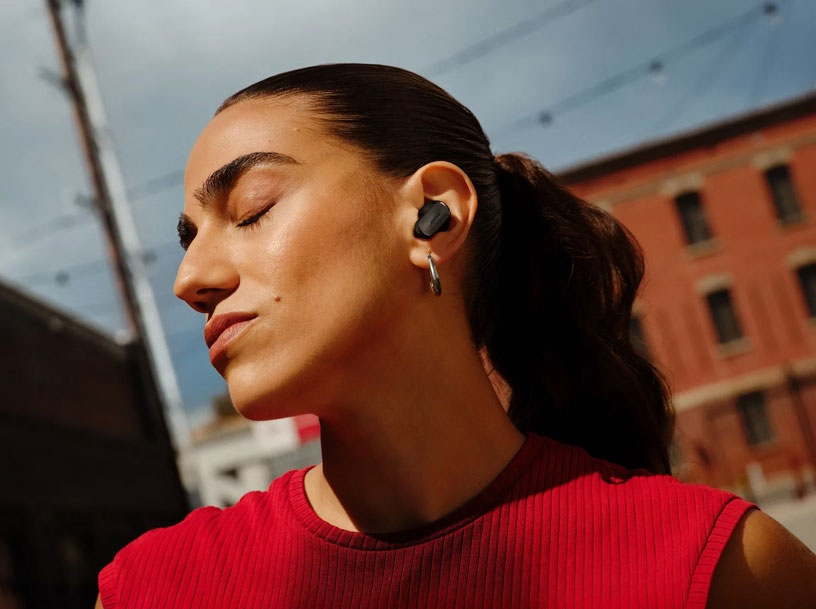 Woman Wearing Bose Wireless Noise Cancelling Earbuds Outdoors