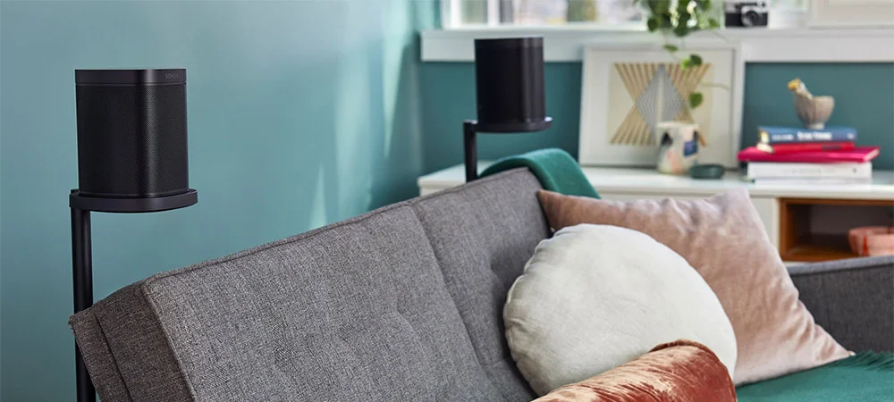 Speakers on Stnads Behind a Couch