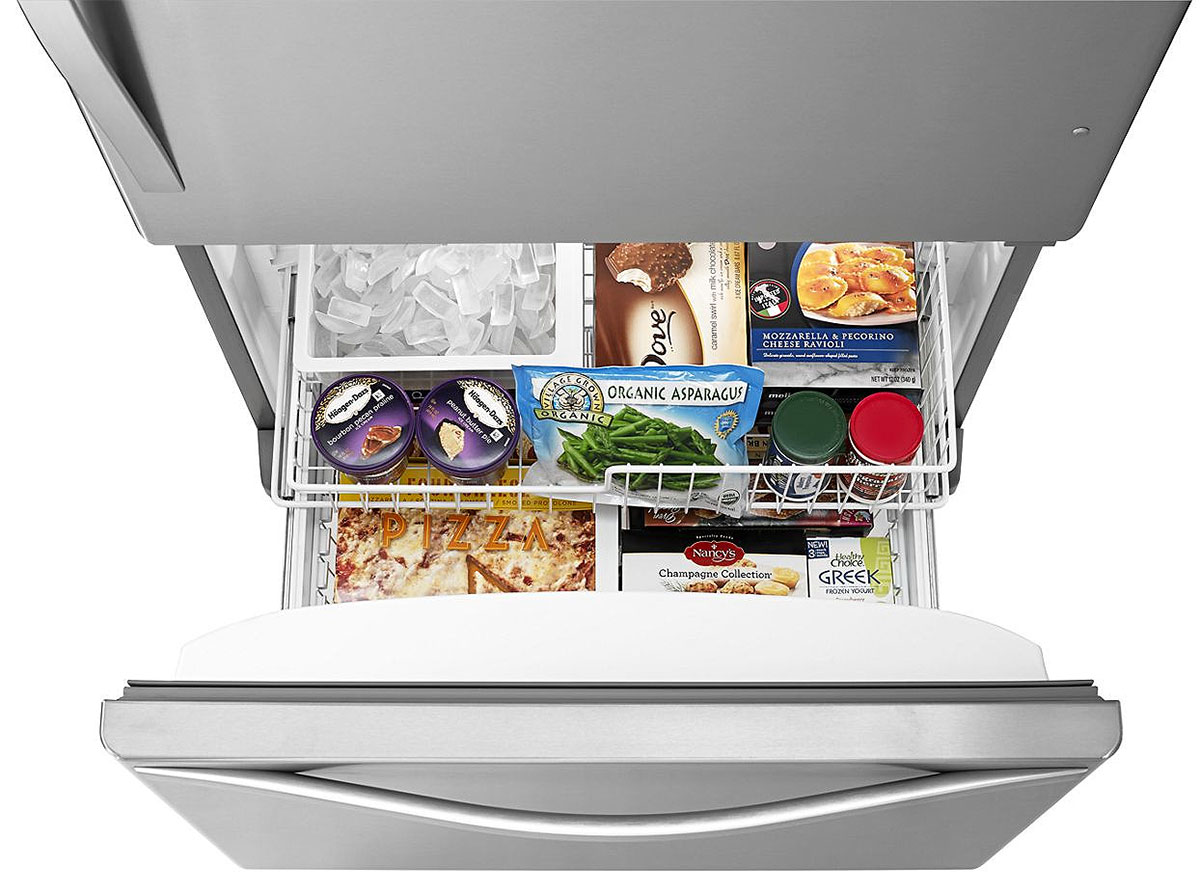Top view of bottom freezer drawer open and full inside
