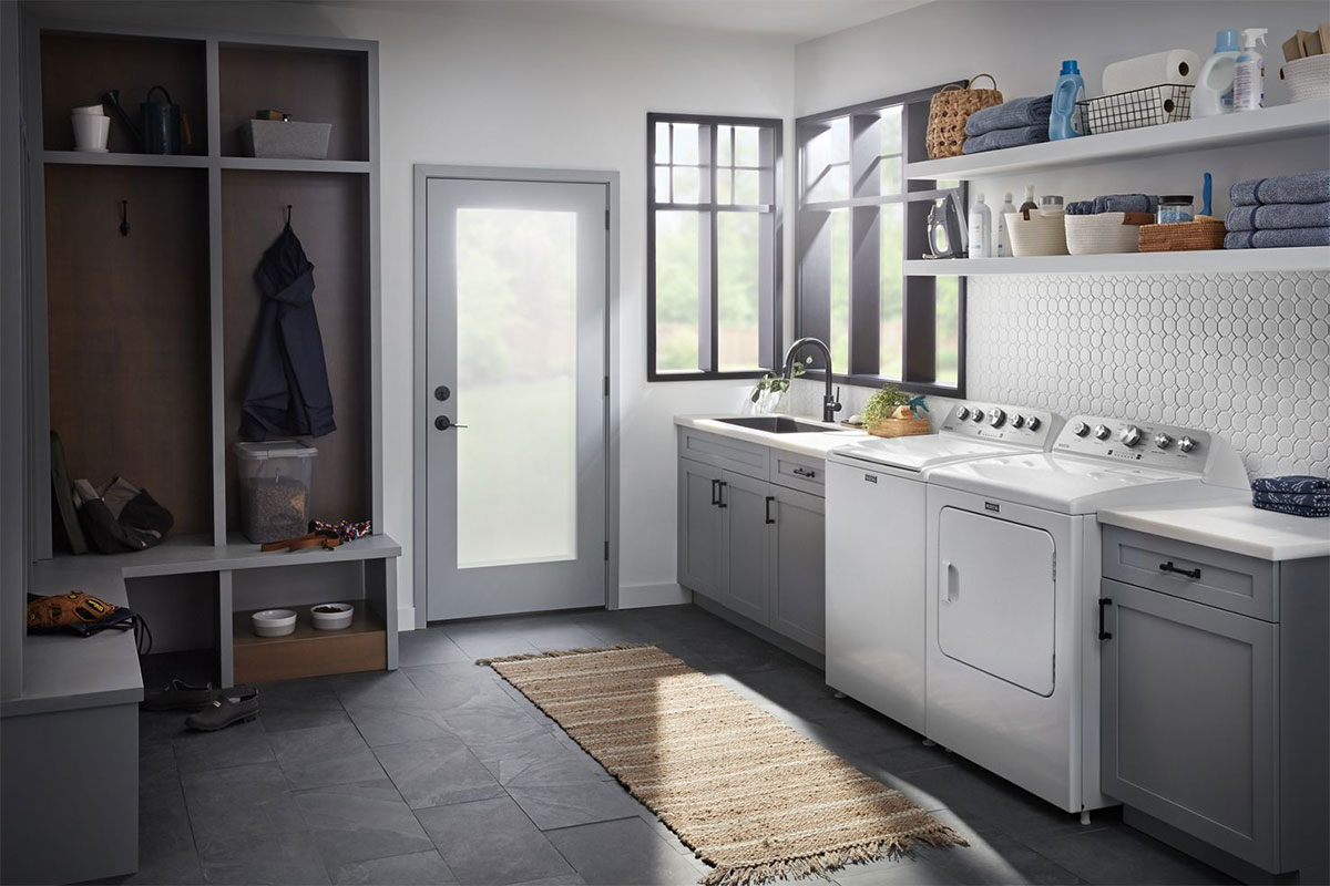 Angle view of washer and dryer in a laundry room.