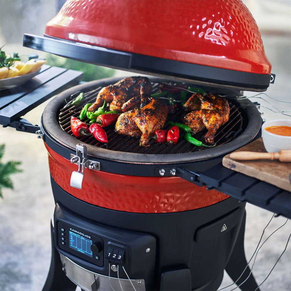 Kamado Joe Charcoal Smoker and Grill Showing Vegetables and Chicken Cooking
