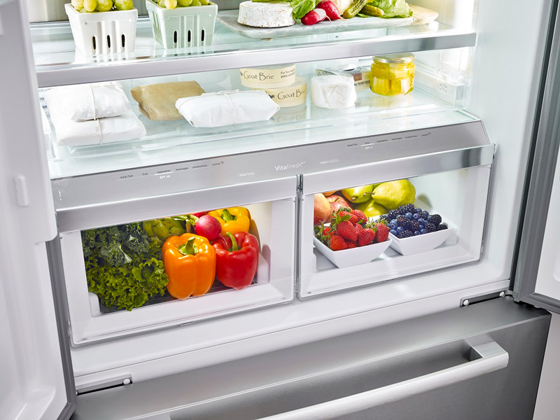 Open Bosch 800 Series 36 Inch Counter-Depth Refrigerator Showing Full Fruit and Vegtable Bins
