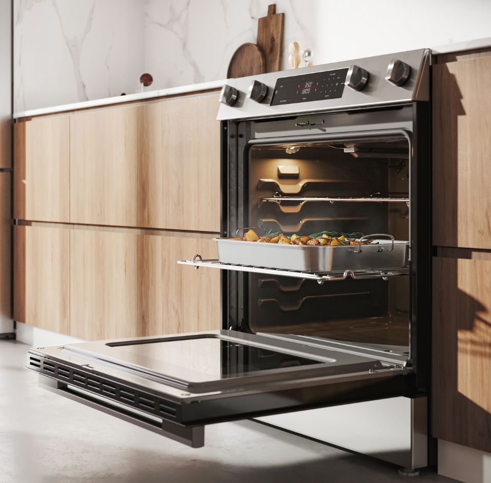 Modern kitchen with white cabinets, blue accents, and high-end Thermador Professional Collection appliances, including a range, rangehood, and wall oven