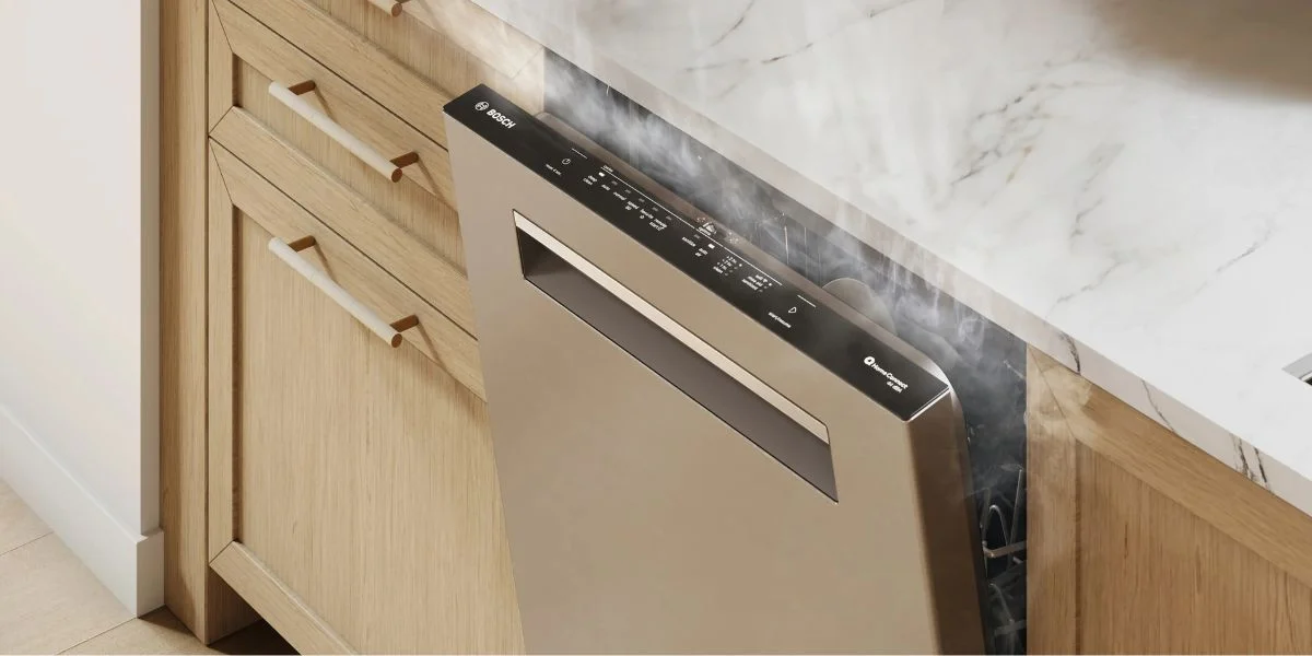 A Bosch 500 Series dishwasher slightly open due to its AutoAir dry system.