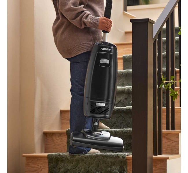 Why carrying an upright vacuum upstairs takes care and technique
