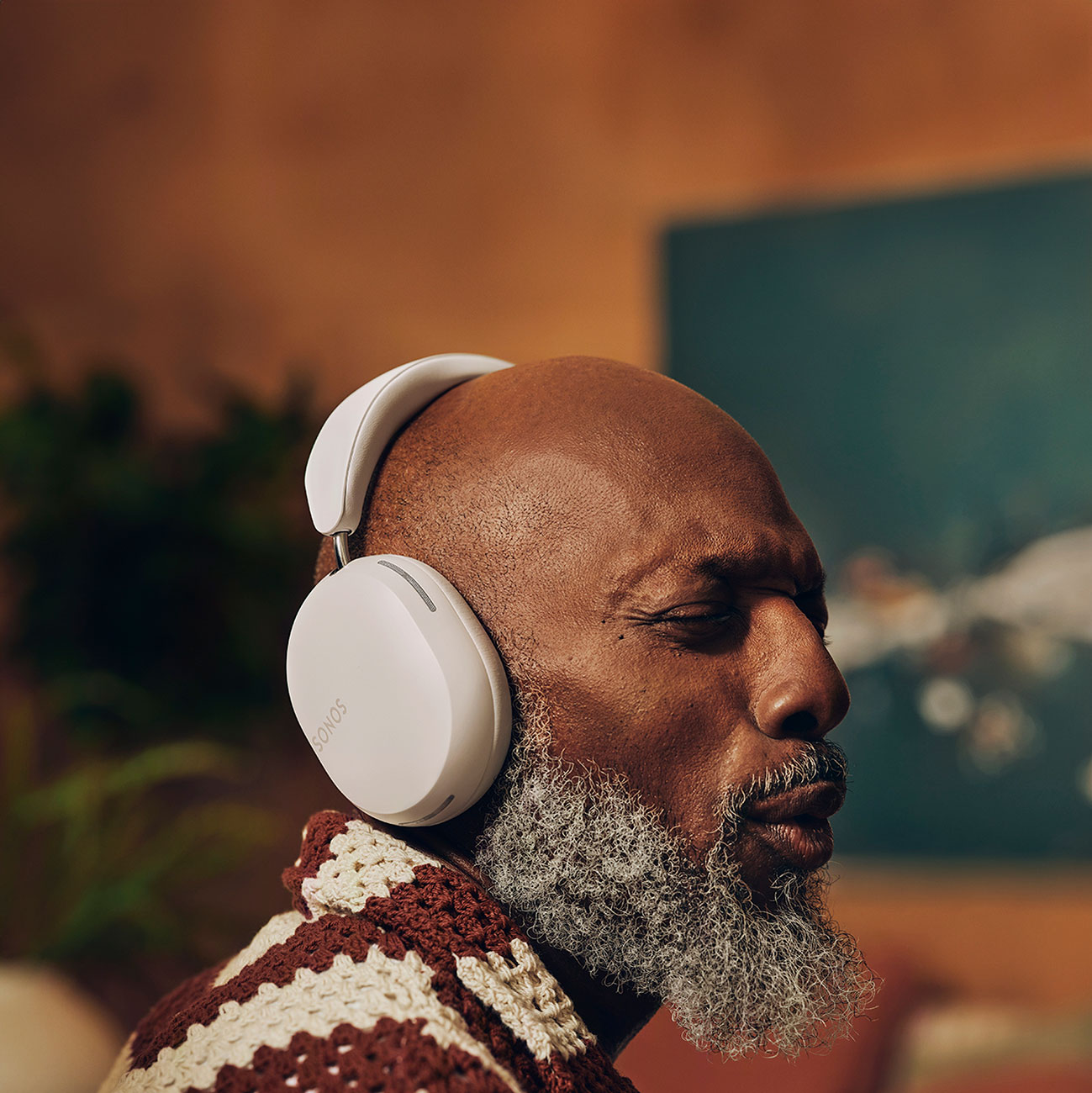 Man Using Sonos Noise Cancelling Headphones Indoors