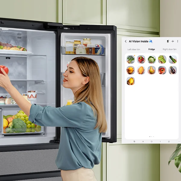 woman taking apple out of Samsung fridge