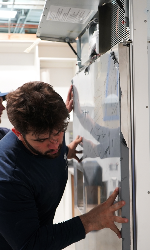 Abt technician working on an air handler
