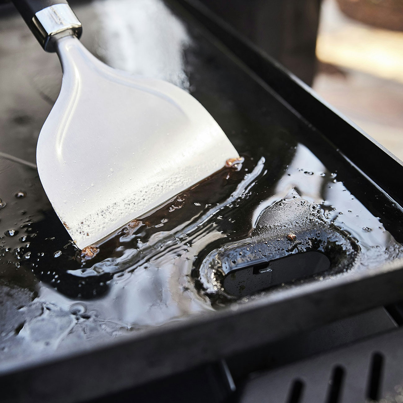 View of Weber Liquid Propane Griddle grease trap