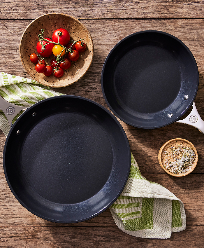 Two skillets on a table