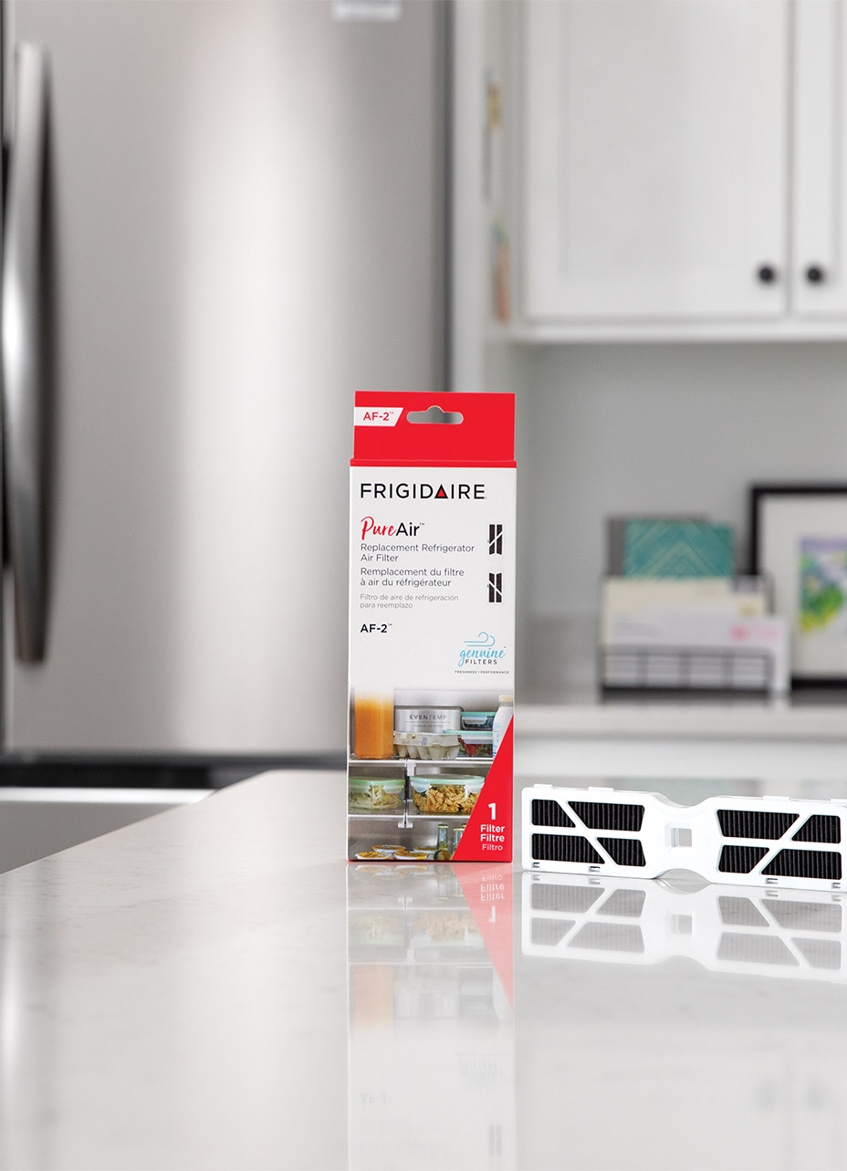 lifestyle image of a frigidaire Gallery refrigerator filter accessory on a kitchen counter