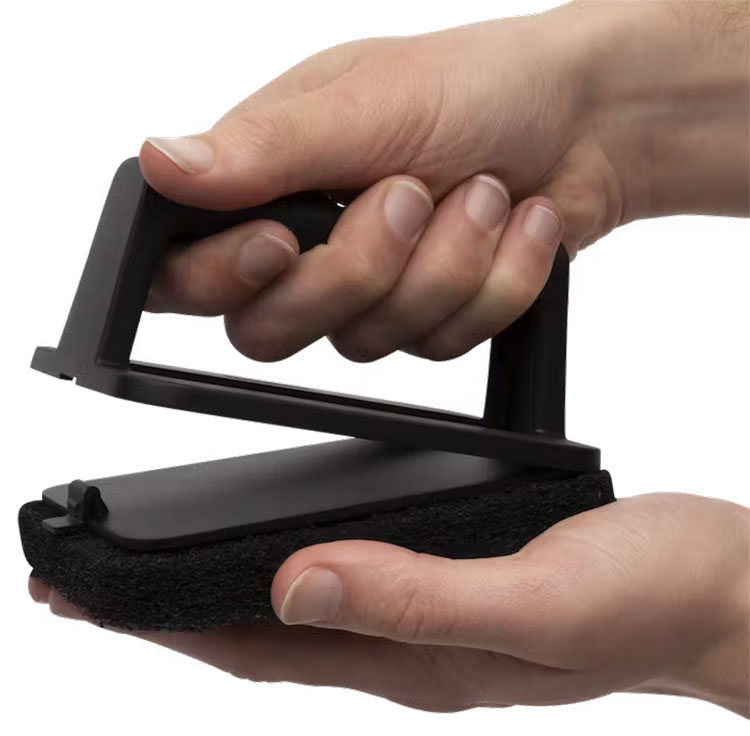 Handle halfway attached to the scour pad.