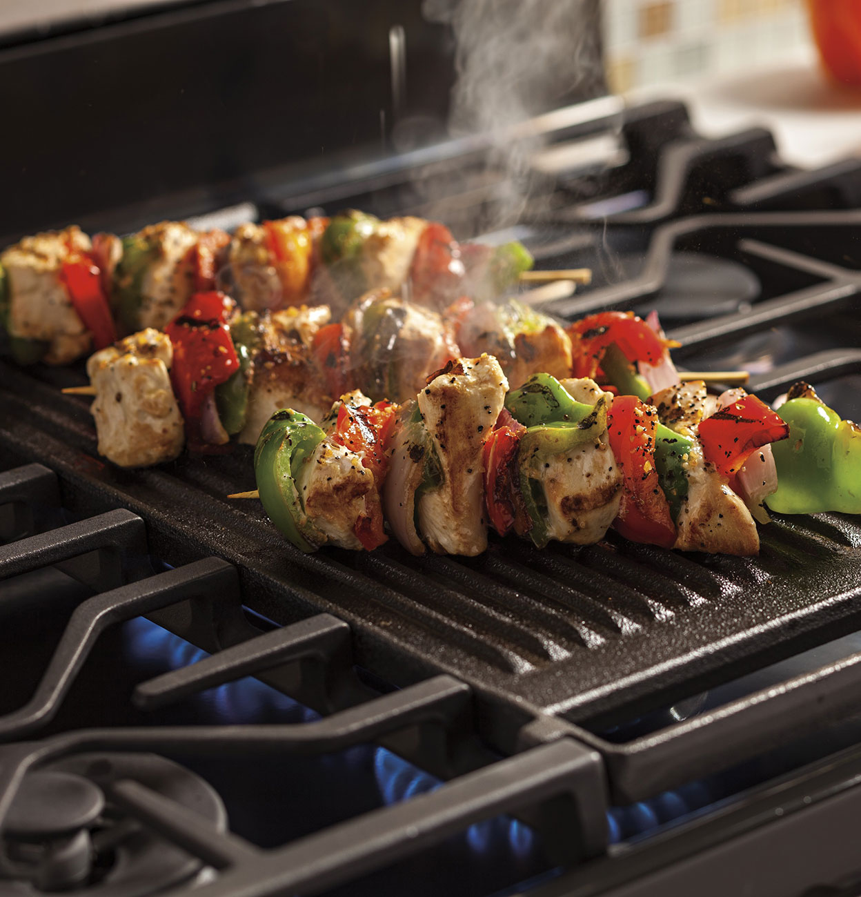 Griddle View Of Ge Profile Gas Range in Use