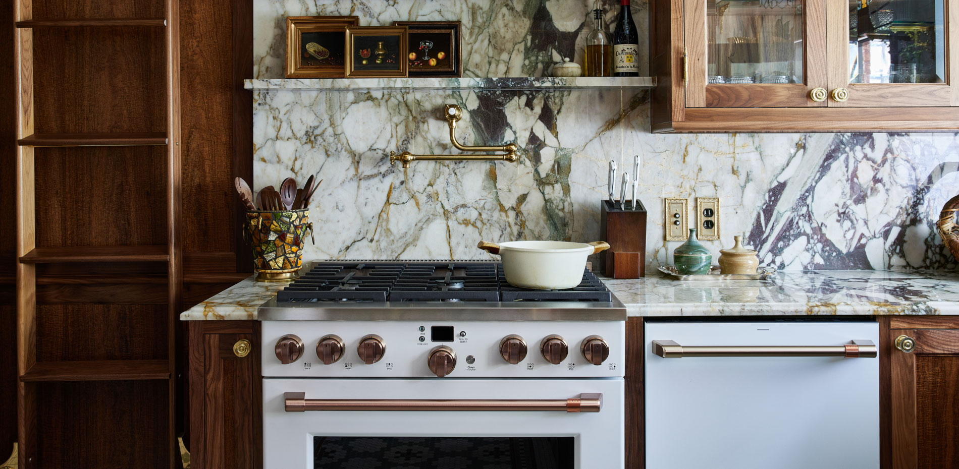 An inviting kitchen with polished marble countertops and classic wood cabinets, exemplifying a harmonious balance of materials