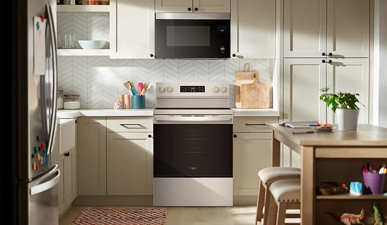 Hero shot of a modern kitchen with whirlpool appliances built in to the kitchen