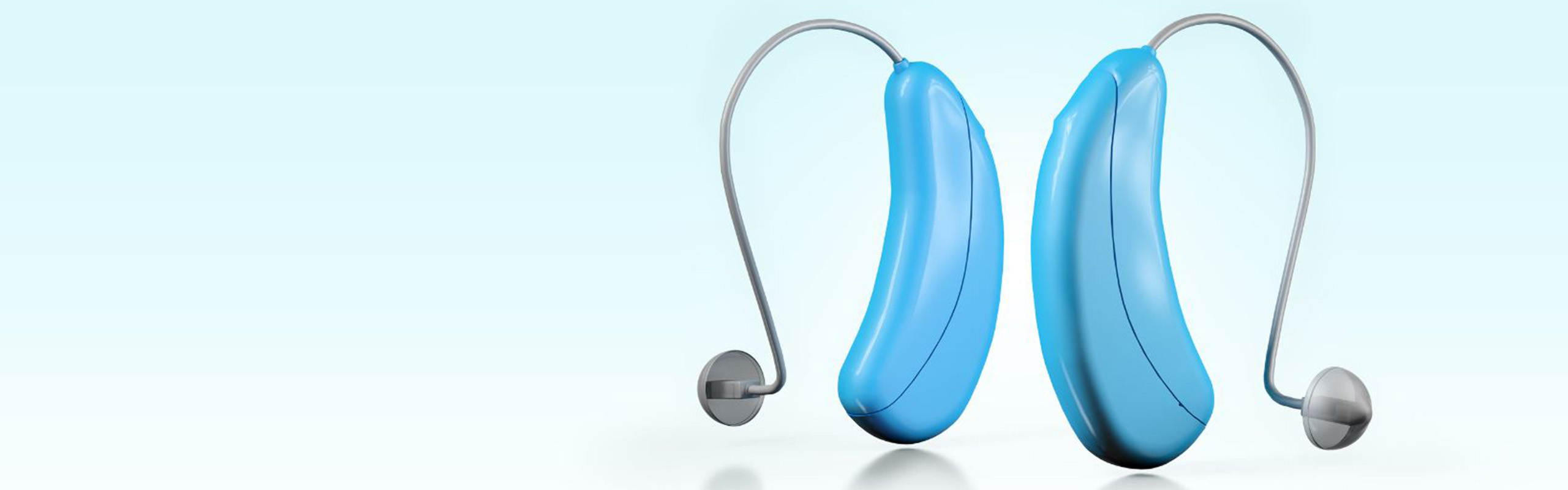 A pair of blue exterior hearing aids against a sky blue background