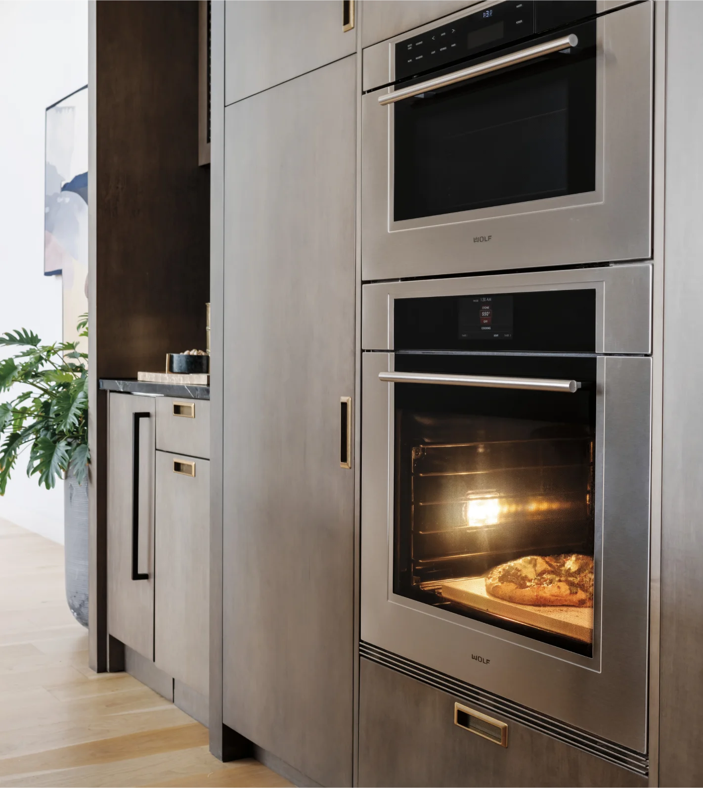 A contemporary kitchen design featuring a Wolf Wall Oven seamlessly integrated into the cabinetry for a polished look