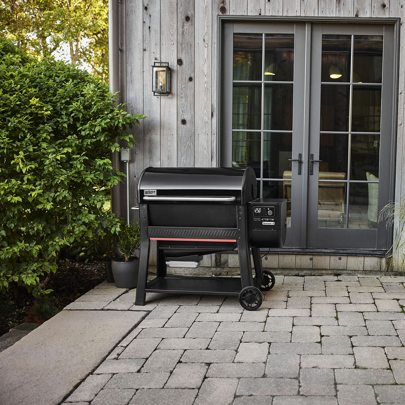Lifestyle View of Weber Searwood 600 Pellet Grill Outside