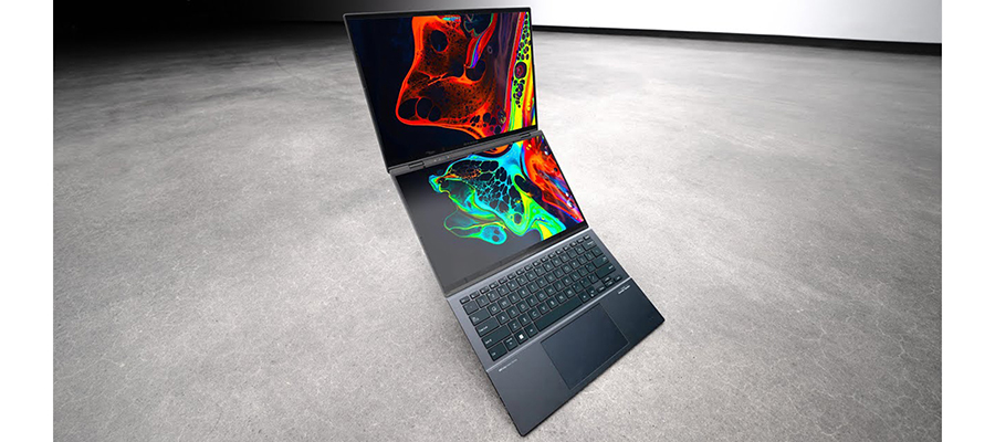 The ASUS Zenbook DUO laptop dual screens open displaying a colorful graphic