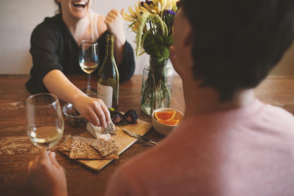 couple eating cheeseboard