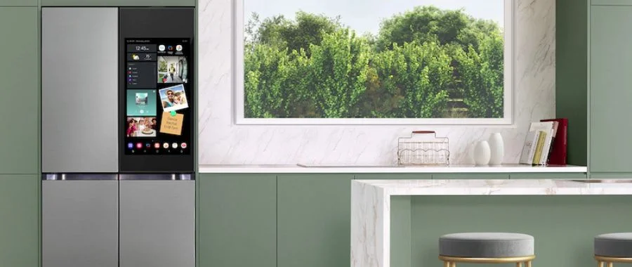 The Samsung bespoke AI family hub plus 4-door flex refrigerator in a sage green kitchen