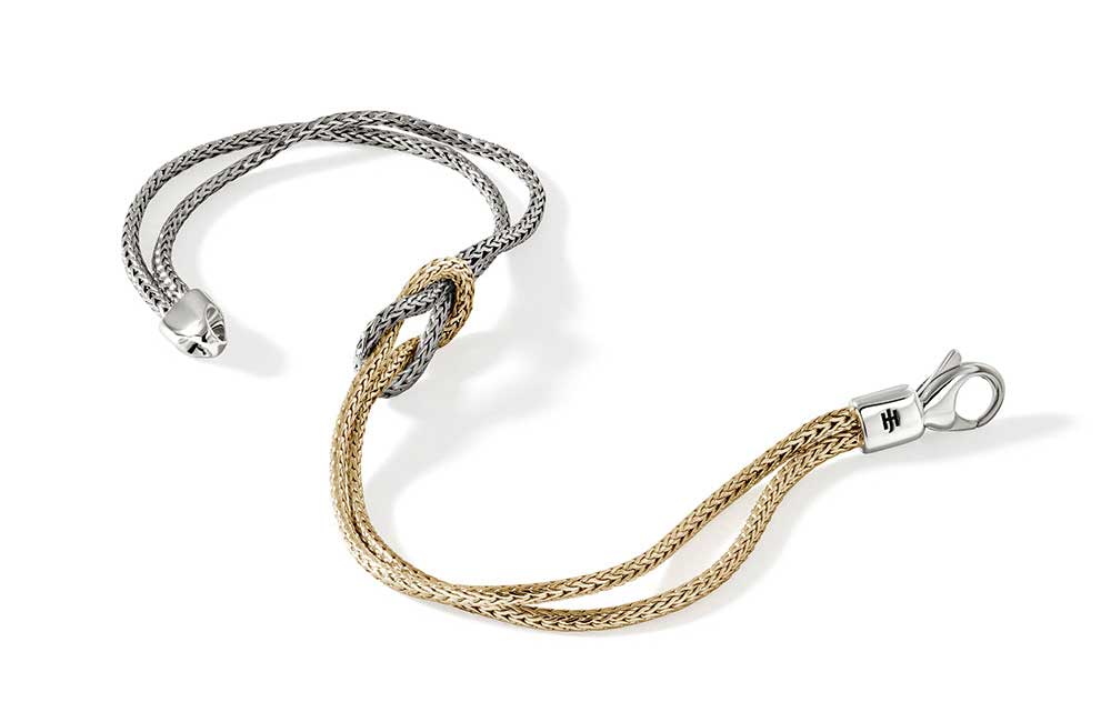Opened view of silver and gold knot chain bracelet