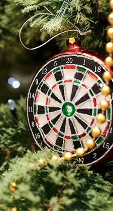 Dart Board Ornament hanging on a christmas tree