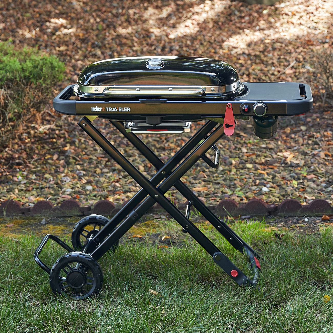 Front view of Weber Traveler Portable Liquid Propane Gas Grill outside